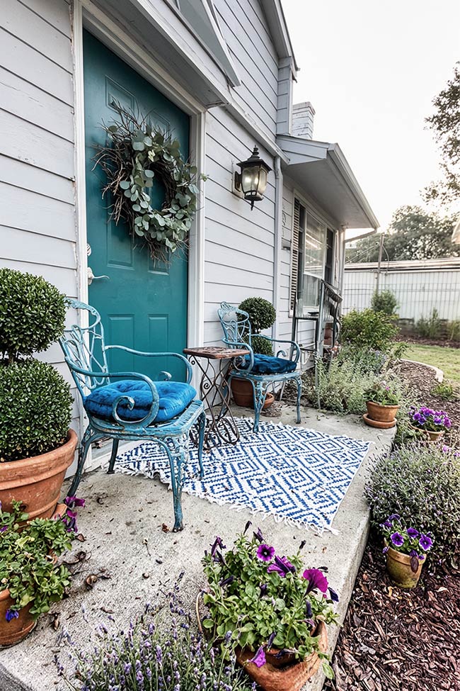 Bold Teal Accents and Modern Metal Seating for the Front Door Porch