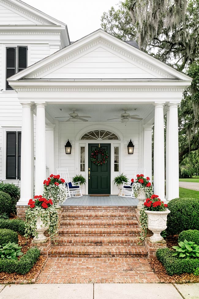 Classic White Columns and Red Flower Porch