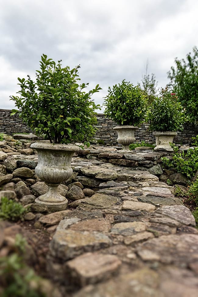 Grand Stone Urns for a Formal Rock Garden Look