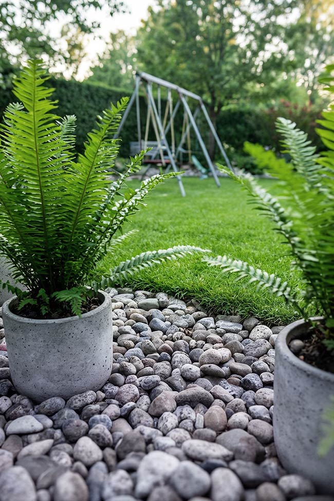 Lush Ferns and River Stones: A Soft Rock Garden Border