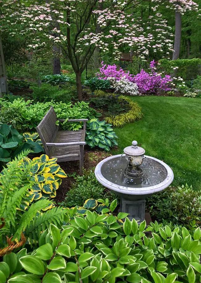 The Elegant Fountain Focal Point of a Lush Shade Garden
